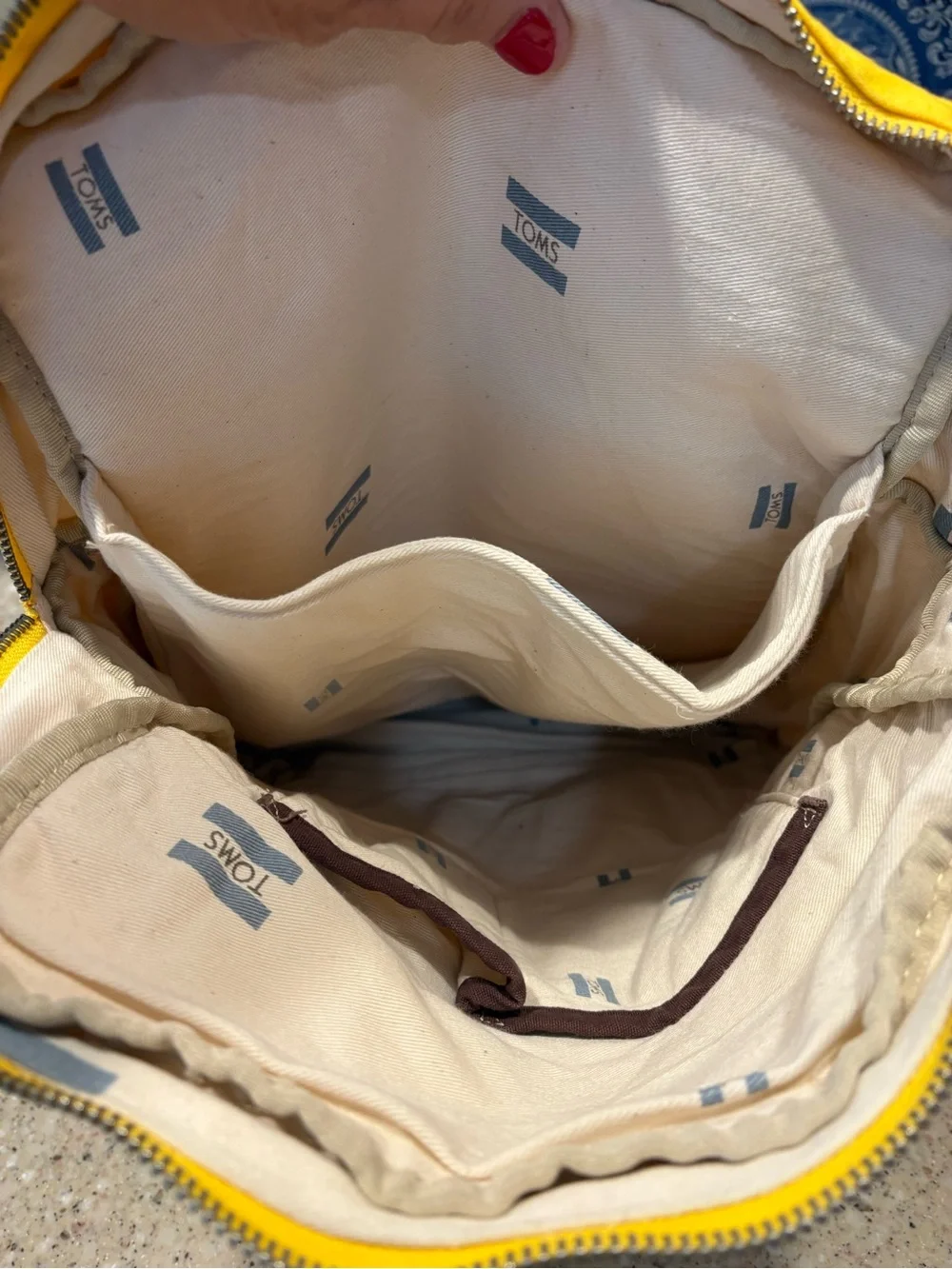 TOMS Citrus Waxed Canvas Trekker Backpack with Brown Base and Roll-Top Closure